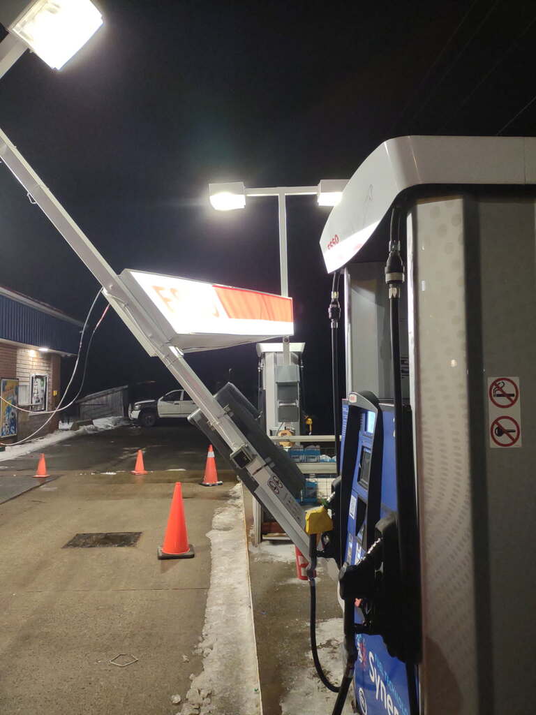 After-hours emergency response to a crash-damaged gas station canopy with unsafe electrical condition