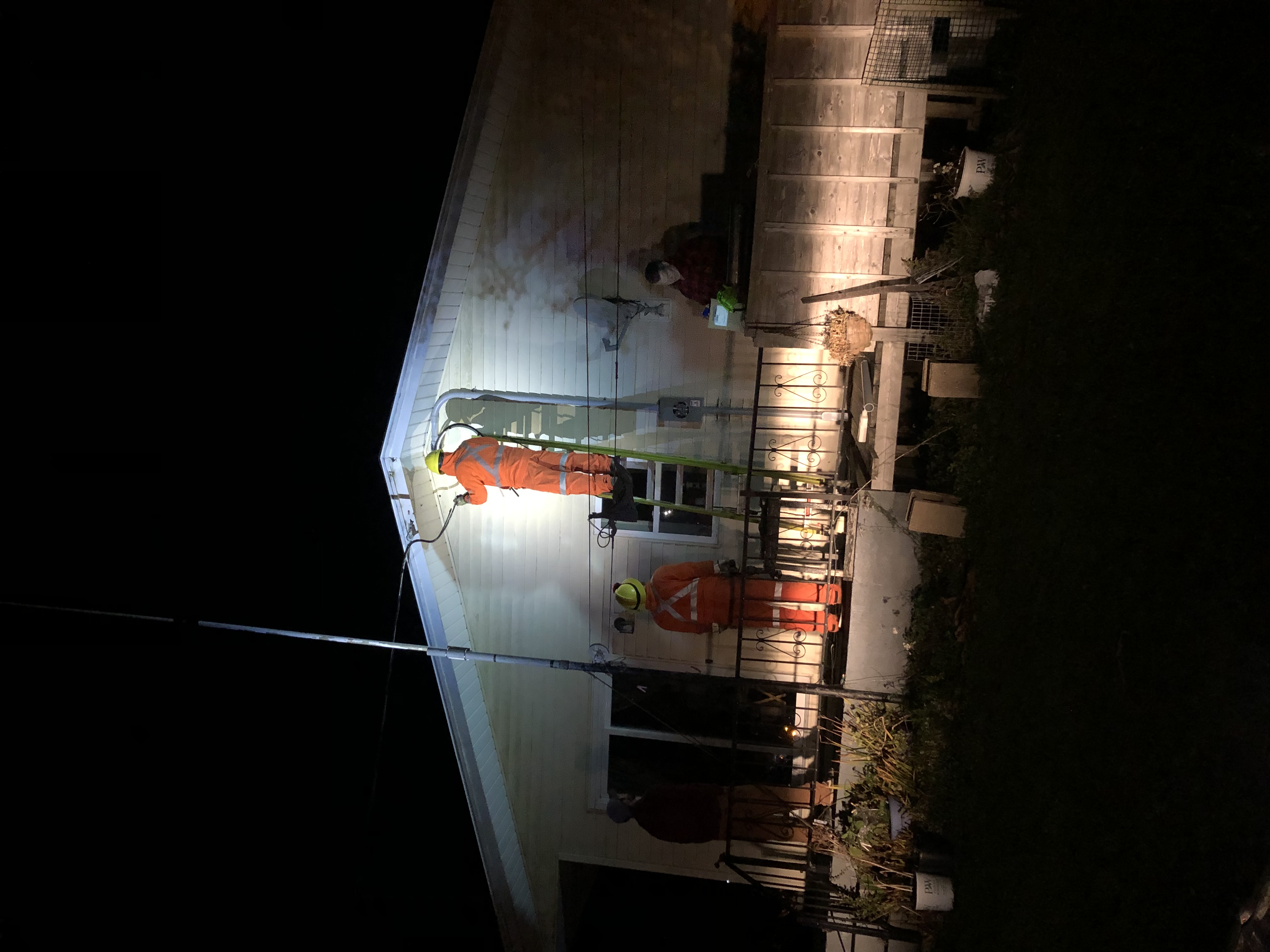 Nighttime emergency electrical service restoration at a residence