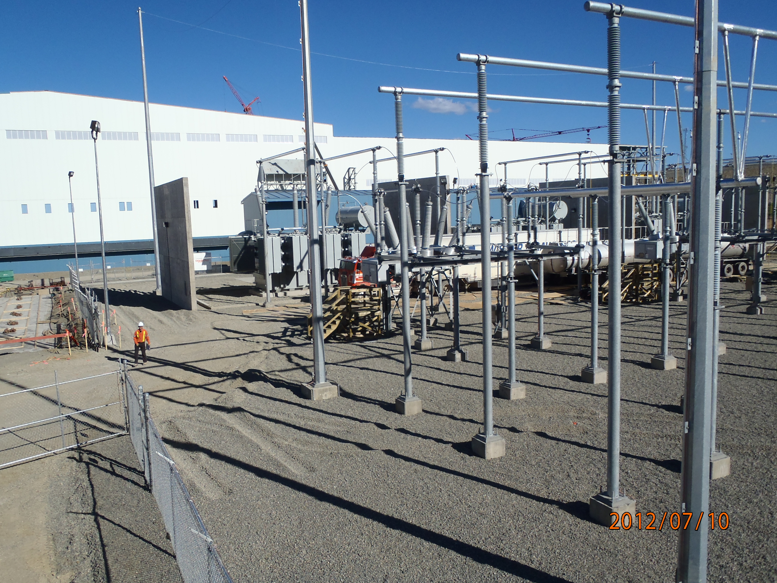 Wide view of a high-voltage substation environment showing large-scale utility infrastructure experience