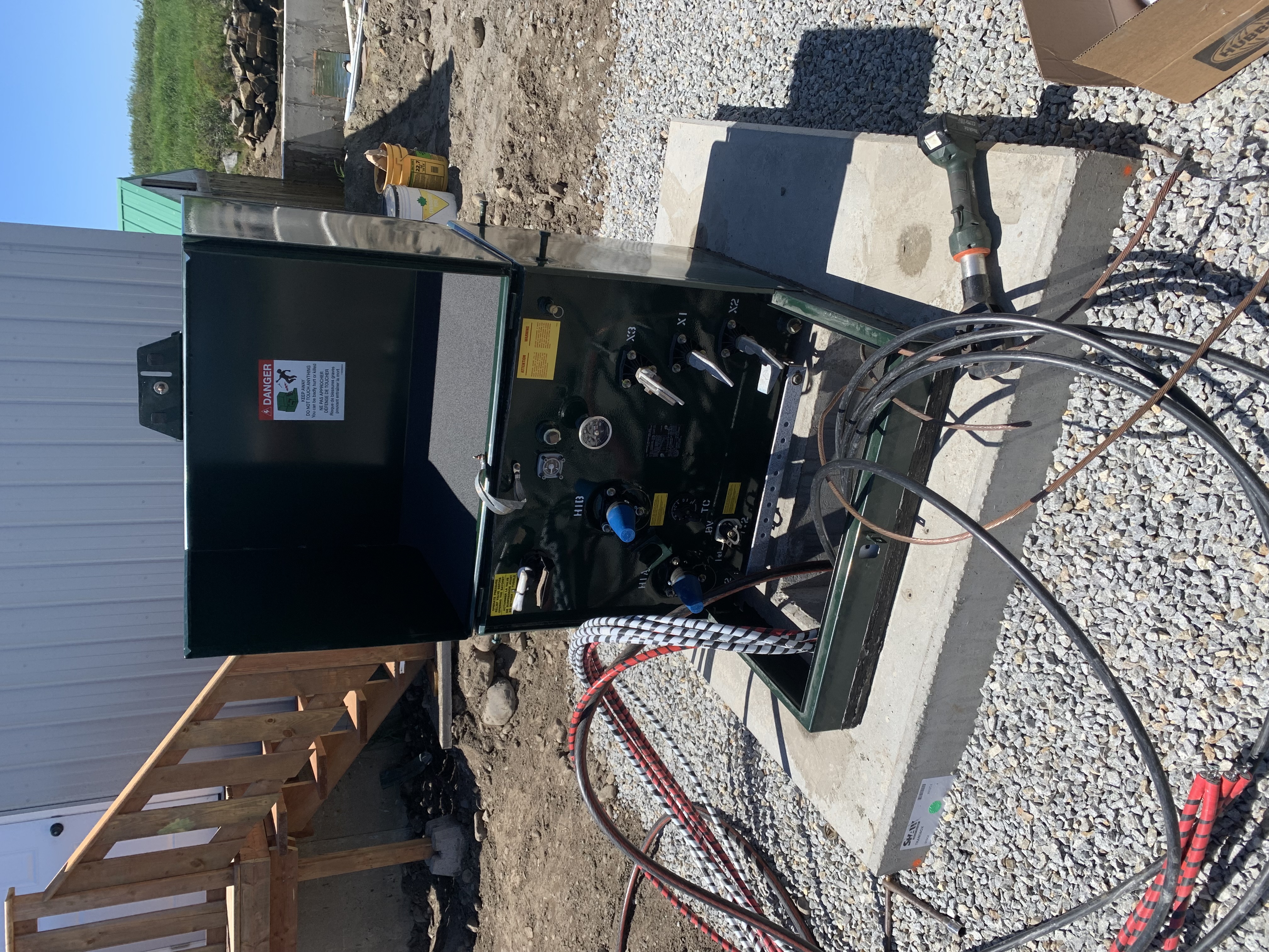 Front view of pad-mounted transformer terminations during cable landing for an 800-amp single-phase service installation
